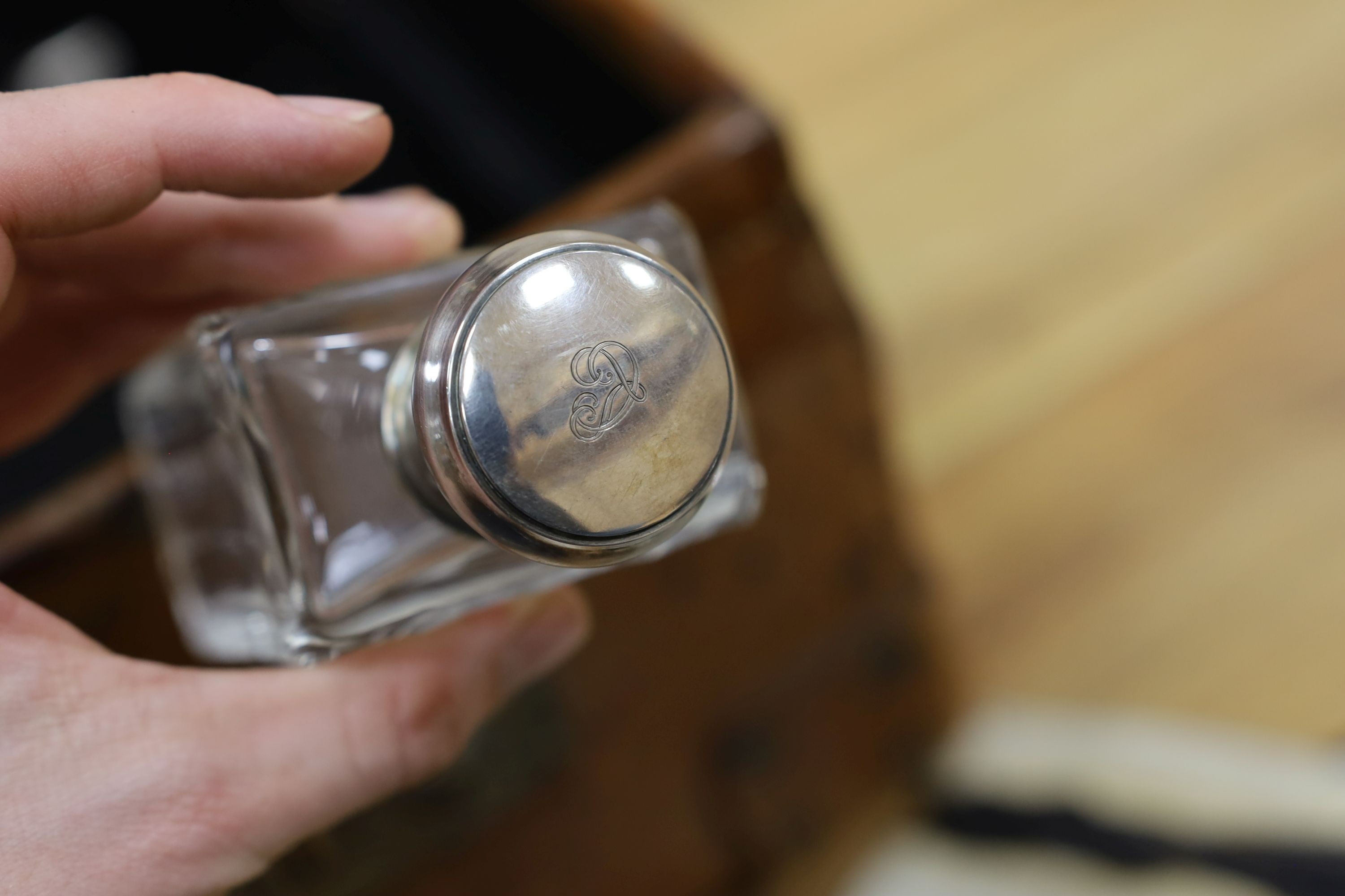 A Dupont travel suitcase, initialled ‘L.C.’ with French white metal mounted bottles